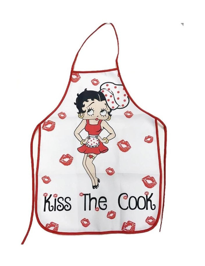 A white kitchen apron with red trim and a cartoon Betty Boop illustration, featuring the text 'Kiss The Cook' and red lip prints scattered across the front.