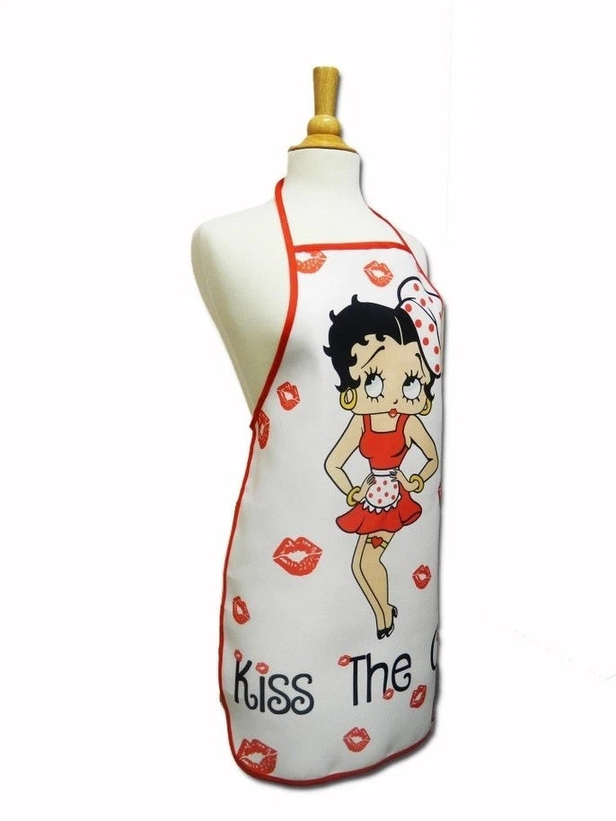 A white kitchen apron with red trim and a cartoon Betty Boop character, displayed on a cream-colored dress form mannequin against a white background.