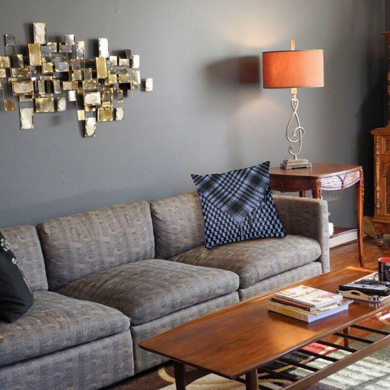 Living room with gray sofa, wooden coffee table, and decorative wall art.