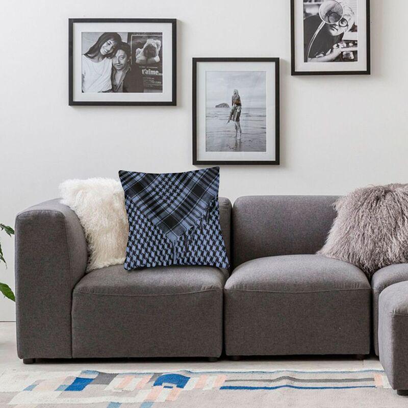 Gray sofa with decorative pillows in a living room setting
