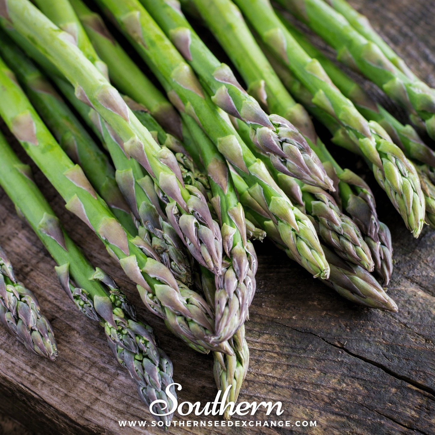 Green asparagus on a wooden surface with 'Southern' branding.