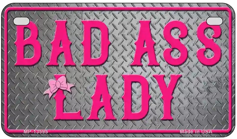 Motorcycle license plate with 'BAD ASS LADY' text in pink on a gray background
