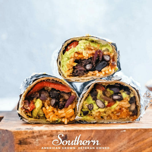 Three burritos stacked on a wooden board with a light blue background, featuring the brand 'Southern'.