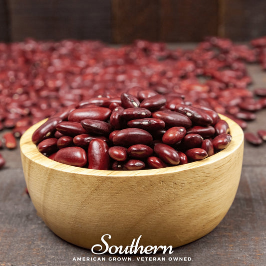 Wooden bowl filled with red beans on a wooden surface with 'Southern' branding.