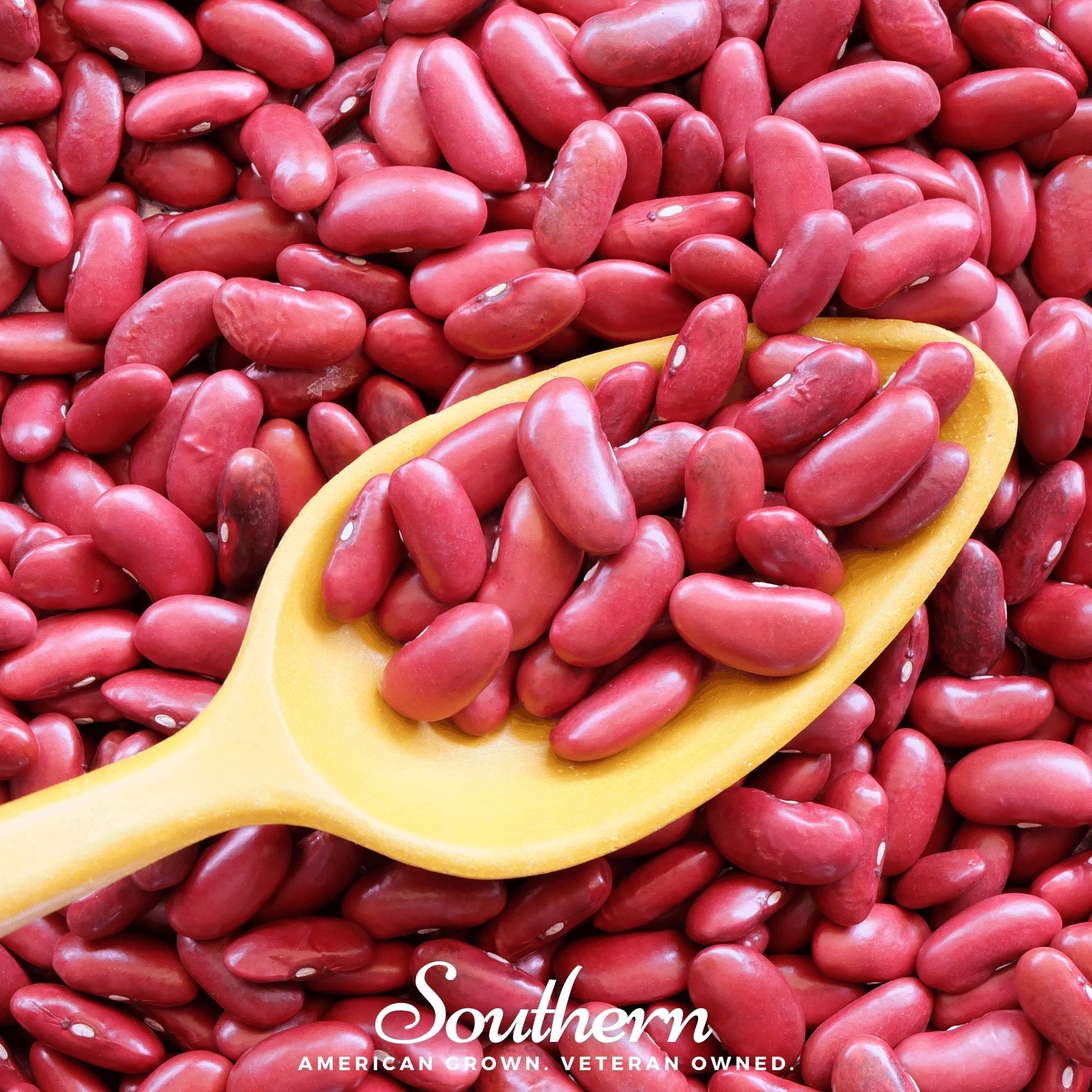 Red kidney beans in a yellow spoon with 'Southern' brand name on a red bean background