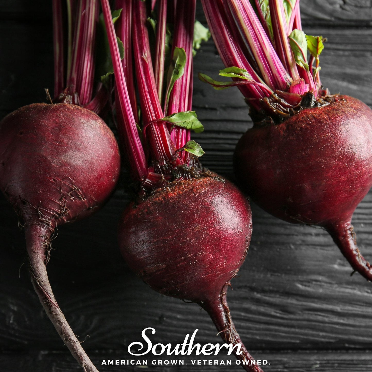 Three beetroots on a dark wooden surface with 'Southern' branding.