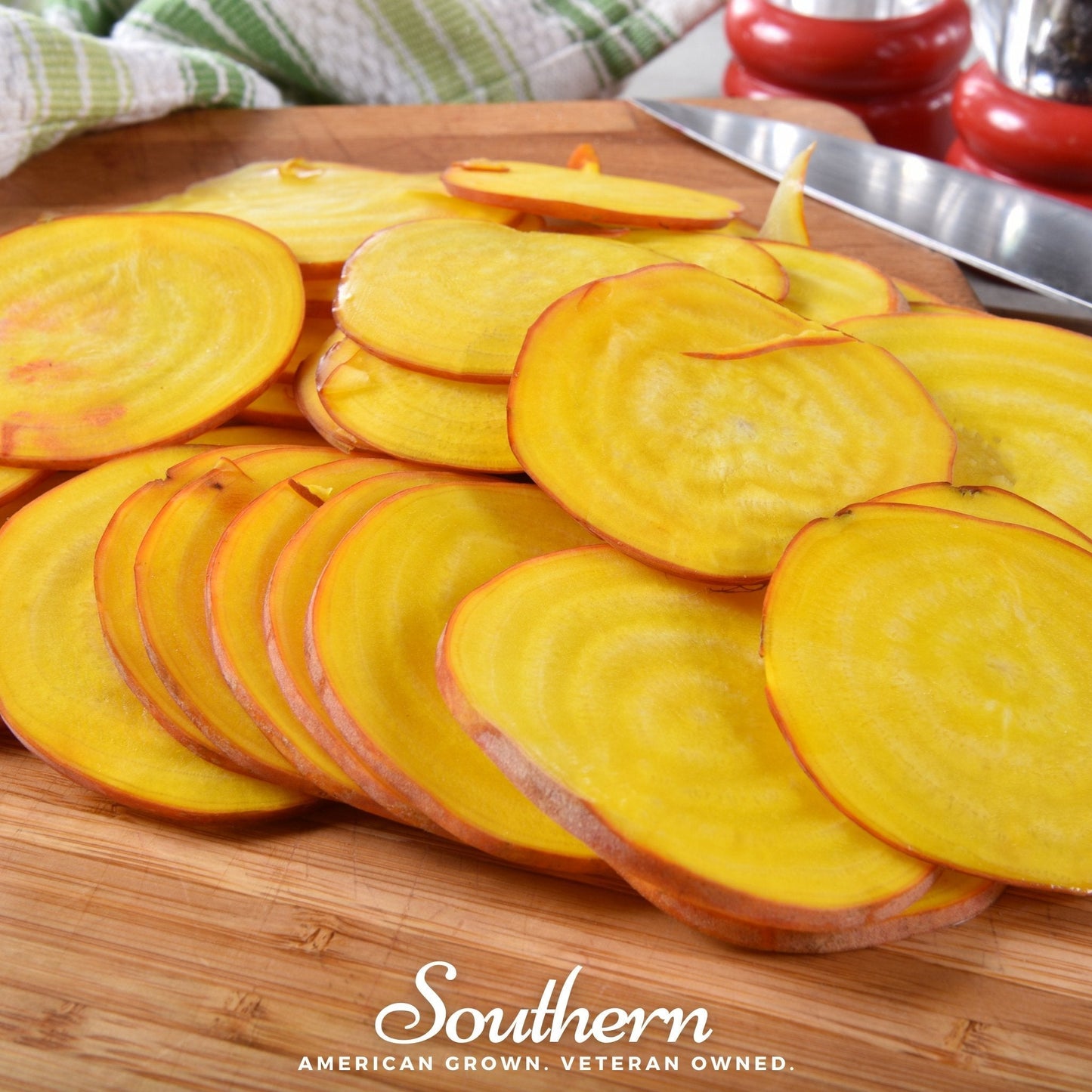 Sliced yellow beets on a wooden cutting board with 'Southern' branding.
