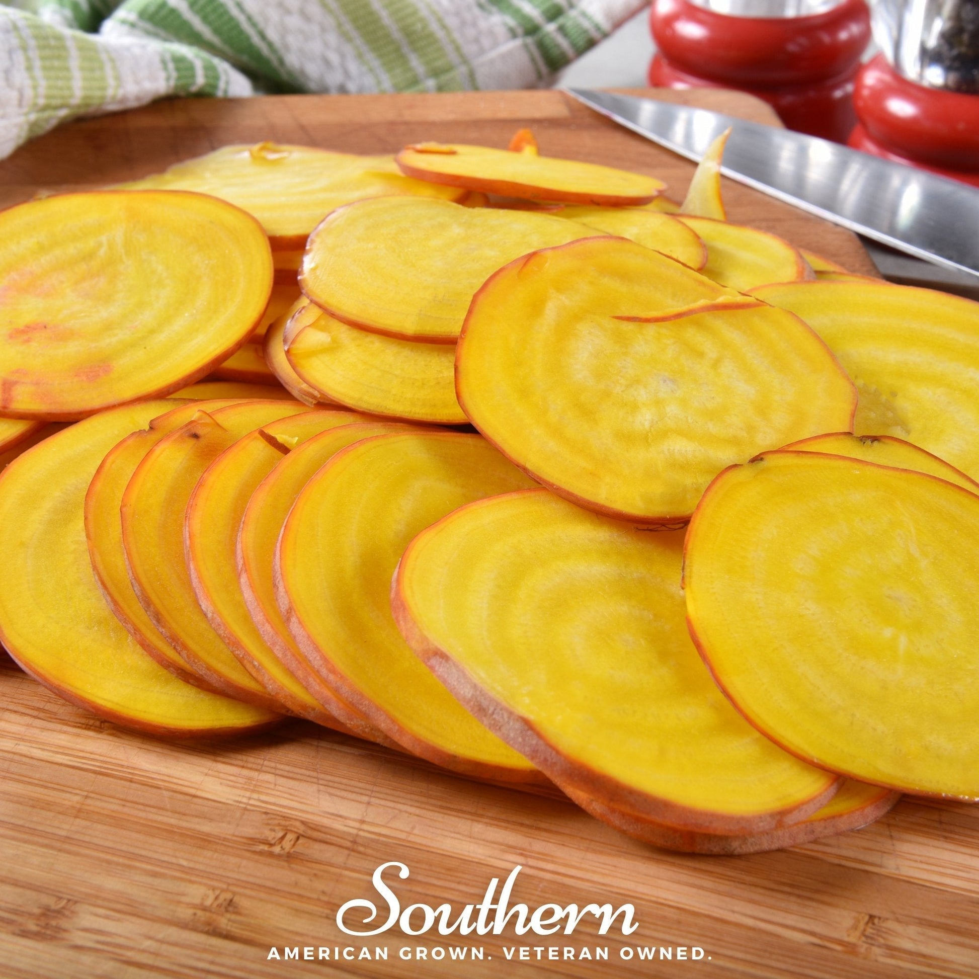 Sliced yellow beets on a wooden cutting board with 'Southern' branding.