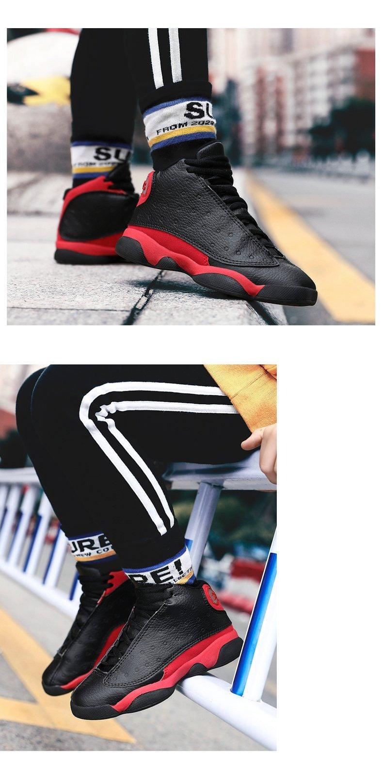 Black high-top sneakers with red soles worn by a person on a blurred urban background.