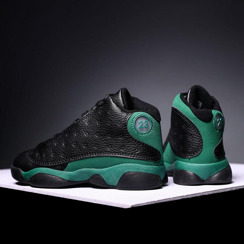 Black and green high-top sneakers on a dark background