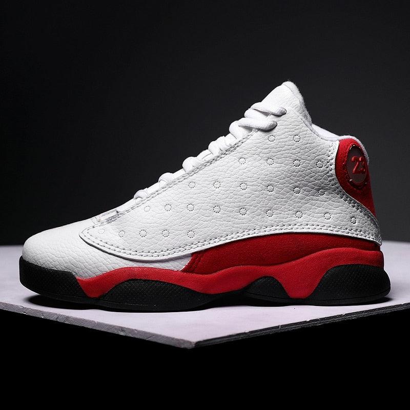 White and red sneaker with black sole on a dark background