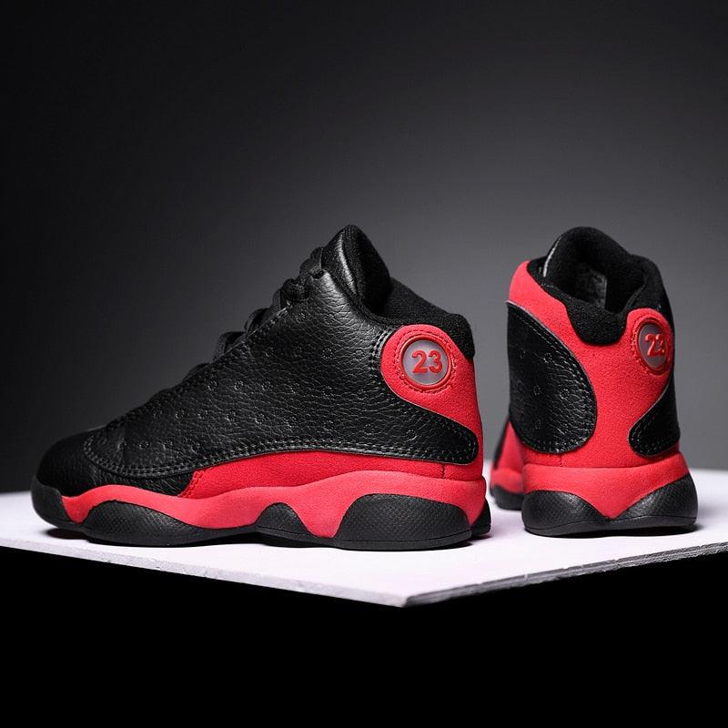 Black and red sneakers with a number 23 on a dark background