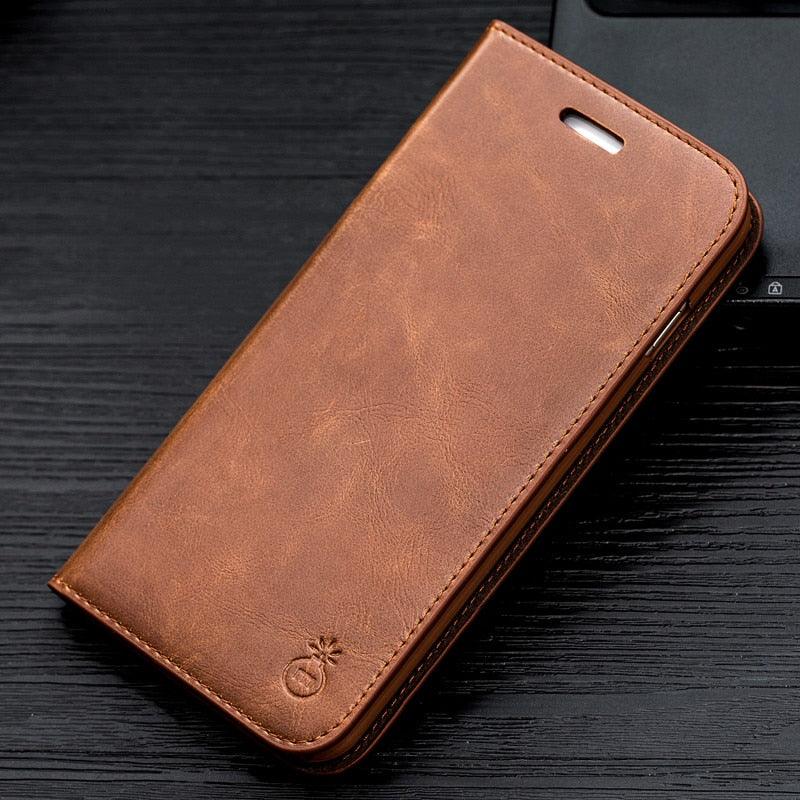 Brown leather phone case on a dark wooden surface