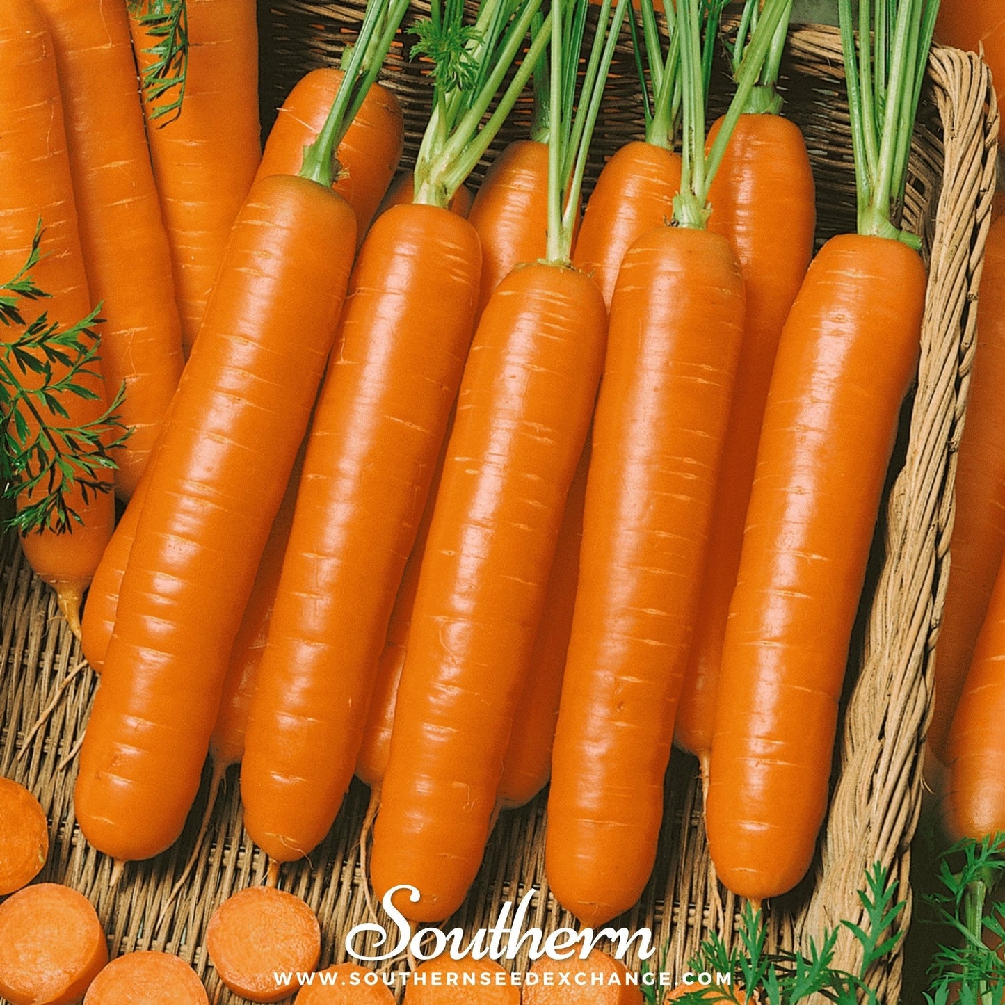Bunch of carrots with green tops on a woven surface, branded 'Southern'.