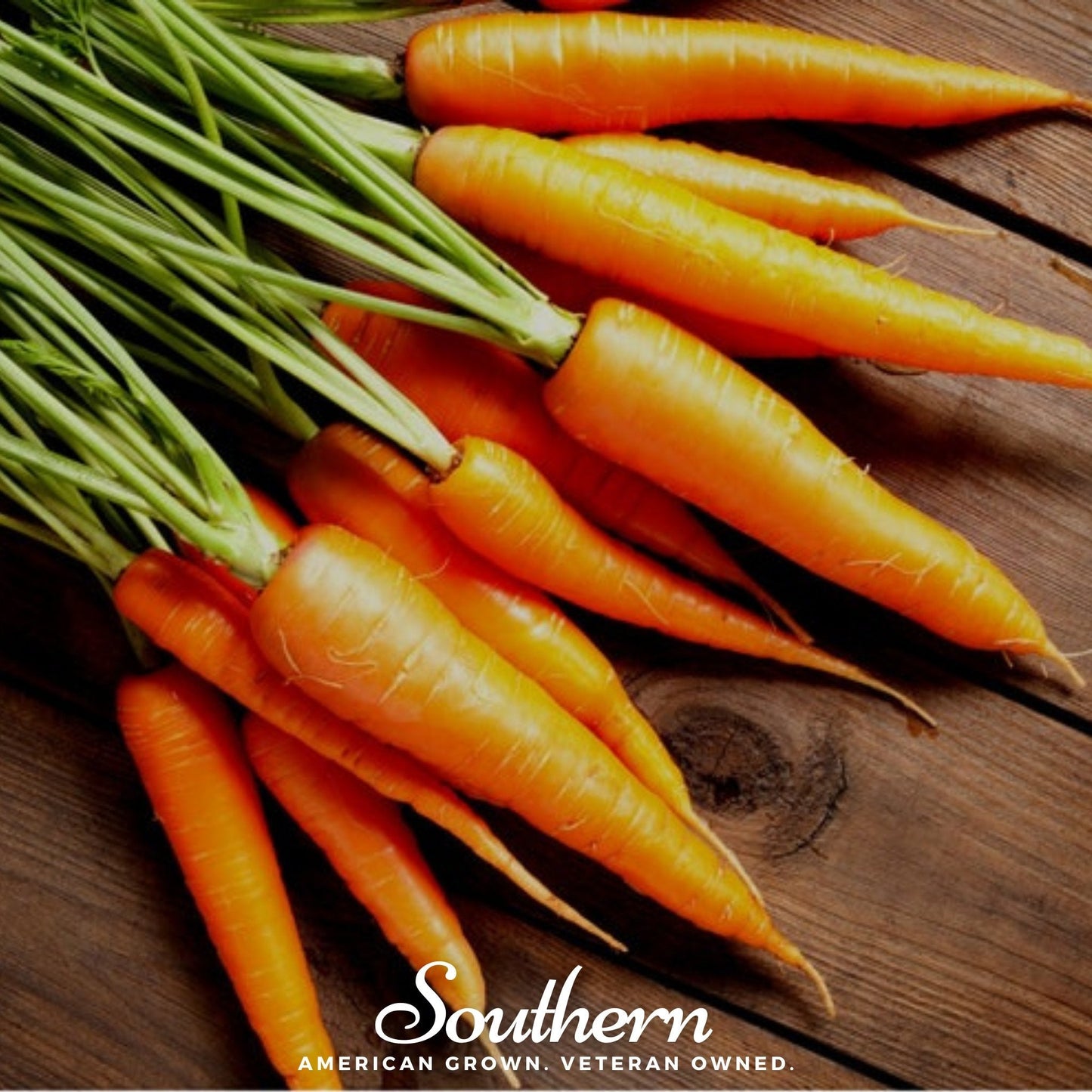 Bunch of carrots on a wooden surface with 'Southern' branding.