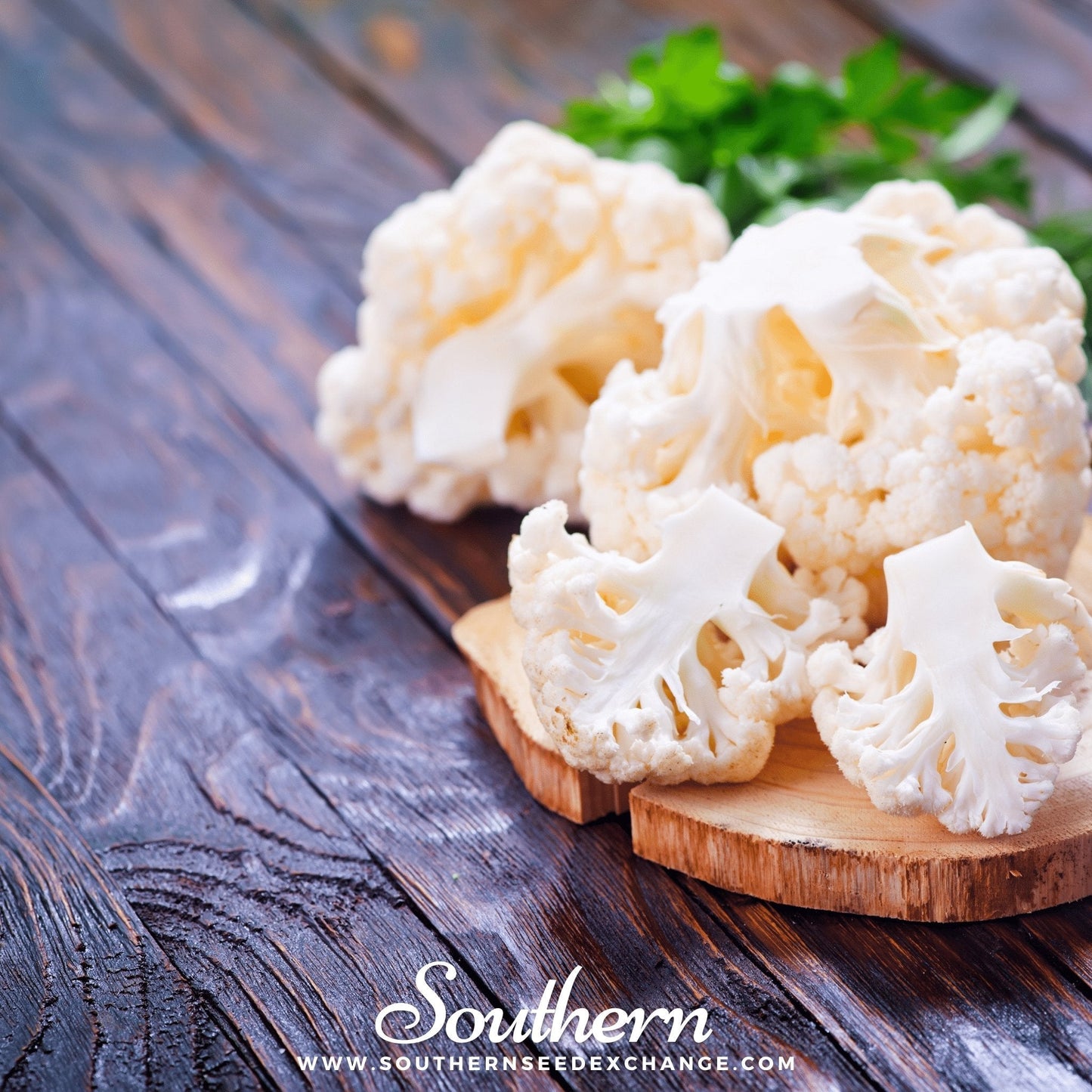 Cauliflower on a wooden board with a rustic background, featuring the brand 'Southern'.