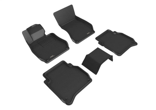 Set of black car floor mats on a white background