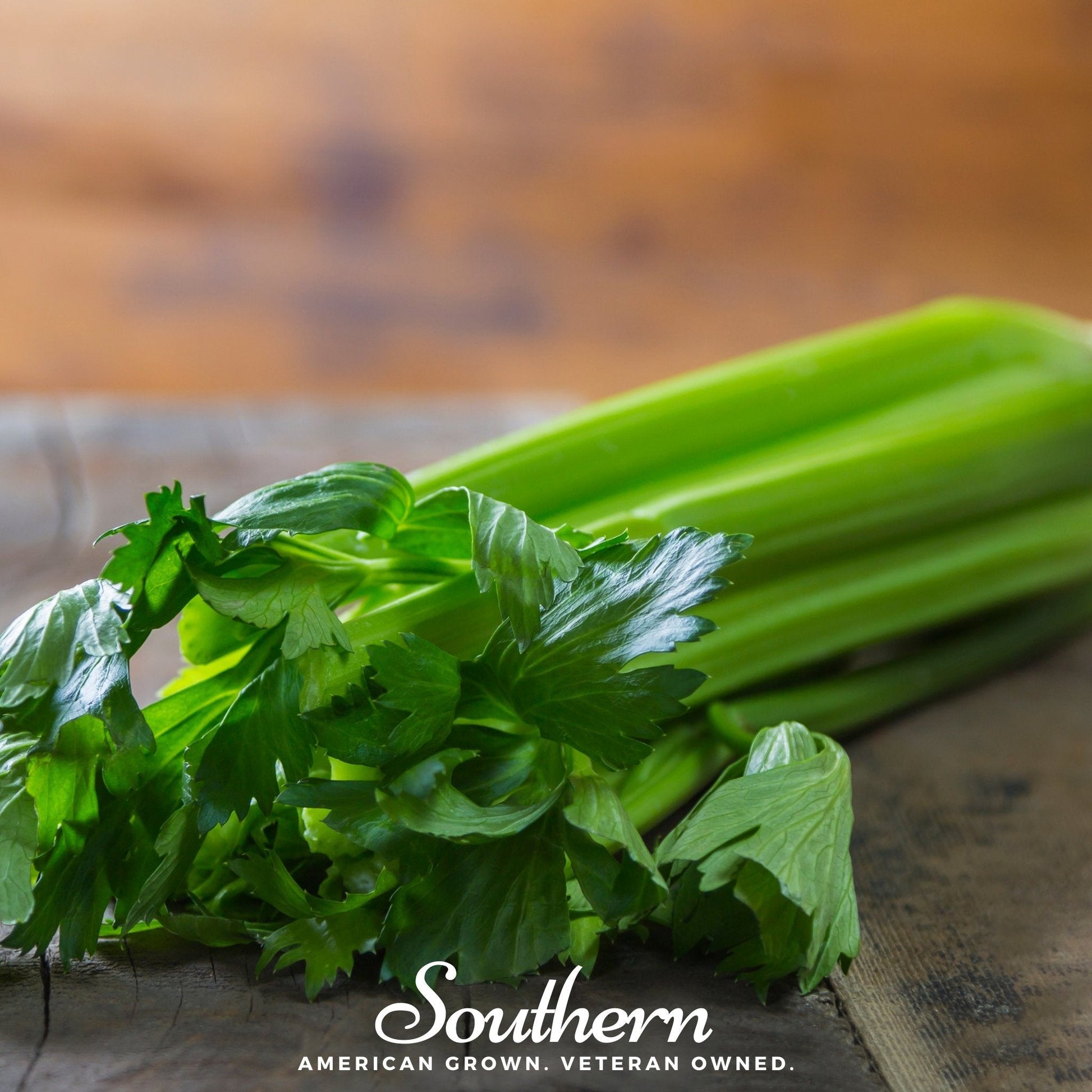 Bunch of celery on a wooden surface with 'Southern' branding.