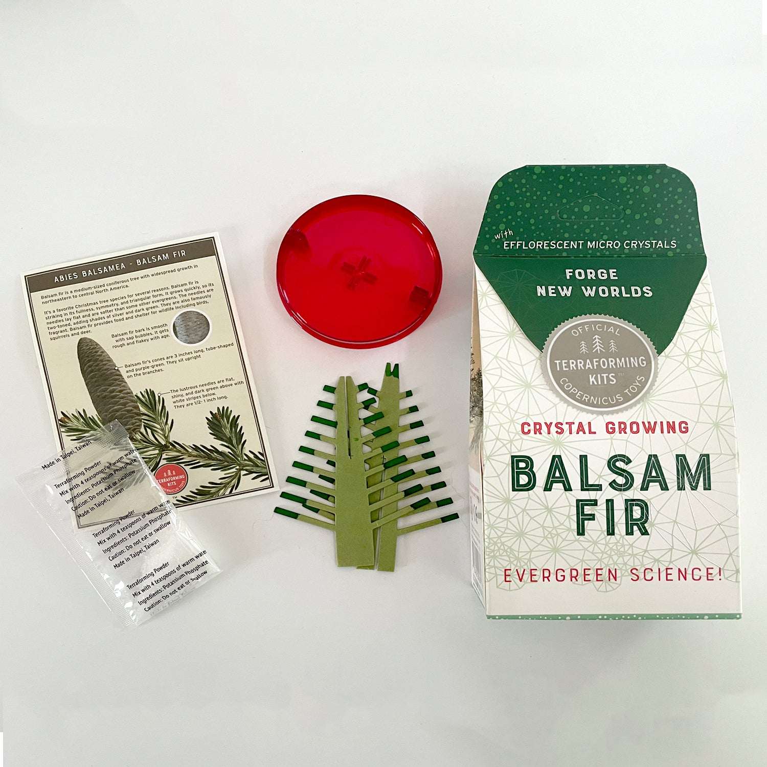 Crystal growing kit for Balsam Fir with packaging, crystals, and instructions on a white background