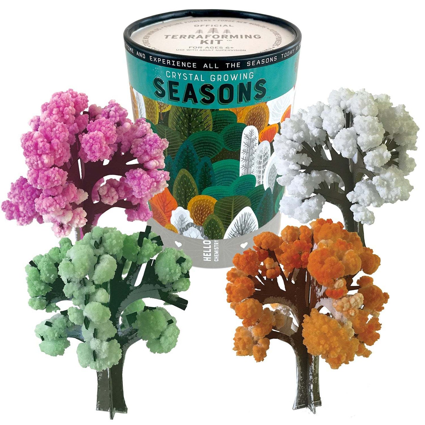 Crystal growing kit with trees in different colors and a container labeled 'Crystal Growing Seasons'.