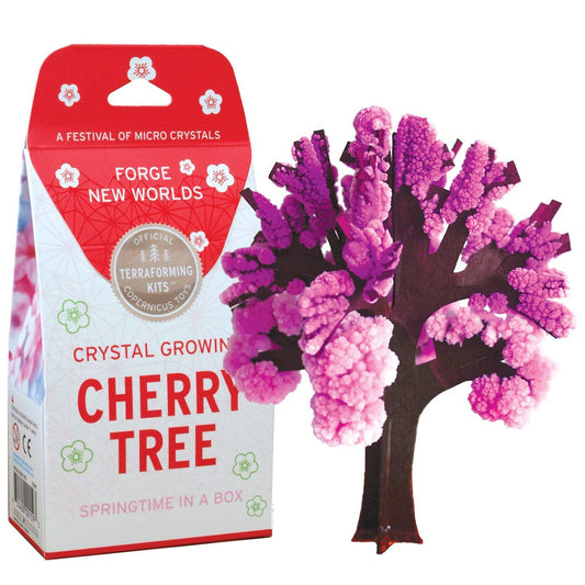 Crystal growing kit packaging for a cherry tree with pink and white crystals on a white background.