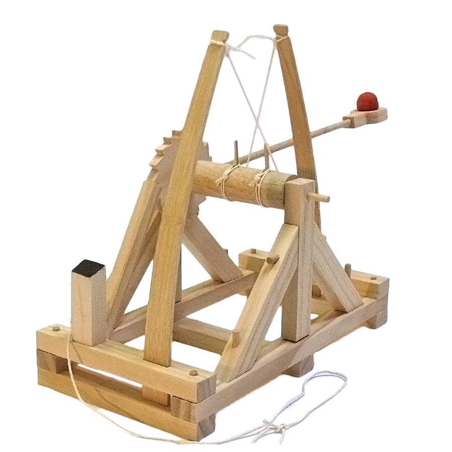 Wooden trebuchet model on a white background