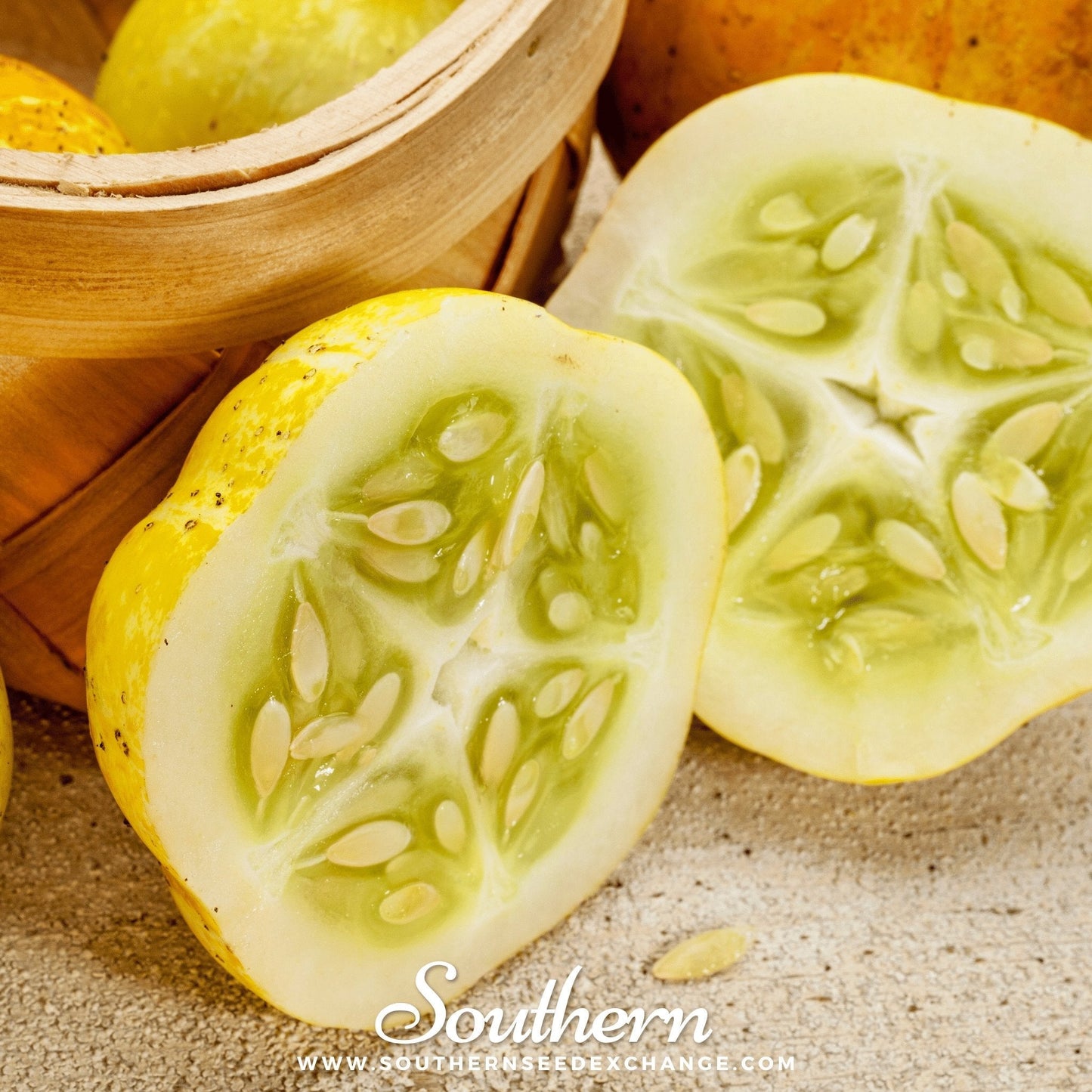 Sliced yellow cucumber with seeds on a textured surface, wooden basket in the background.