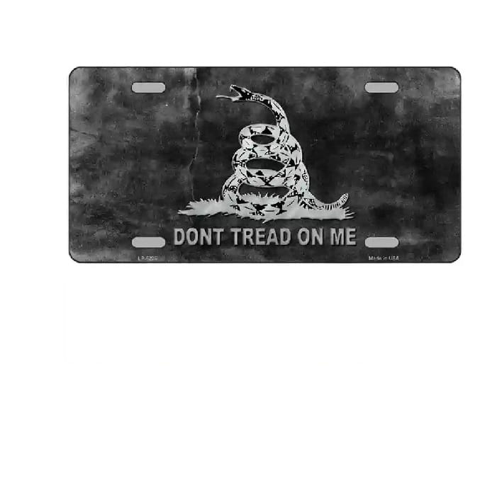 License plate with Gadsden snake design and 'Don't Tread on Me' text on a dark background