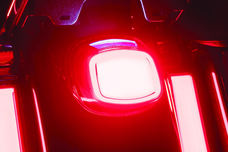 Close-up of a car taillight with a red glow