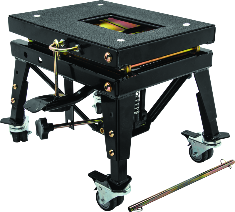 Black mechanical scissor lift with adjustable legs and a platform on a white background