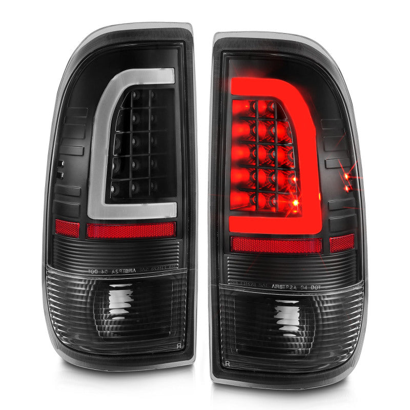Pair of black Ford F150 tail lights with red and clear lenses on a white background