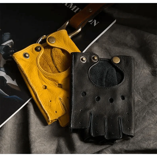 Black and yellow leather gloves on a textured surface