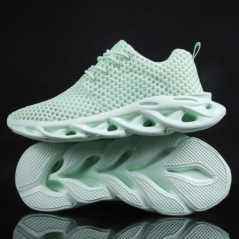 Light green sneaker with unique sole design on a black background