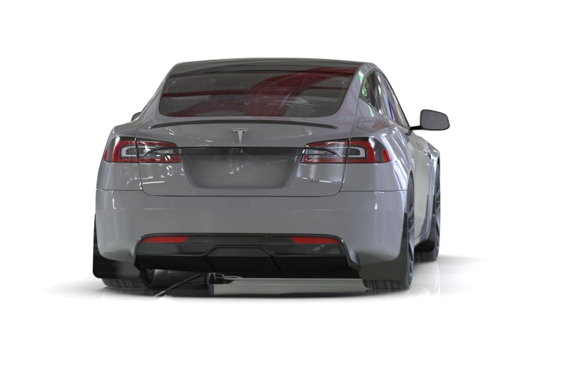 Back view of a Tesla car on a white background