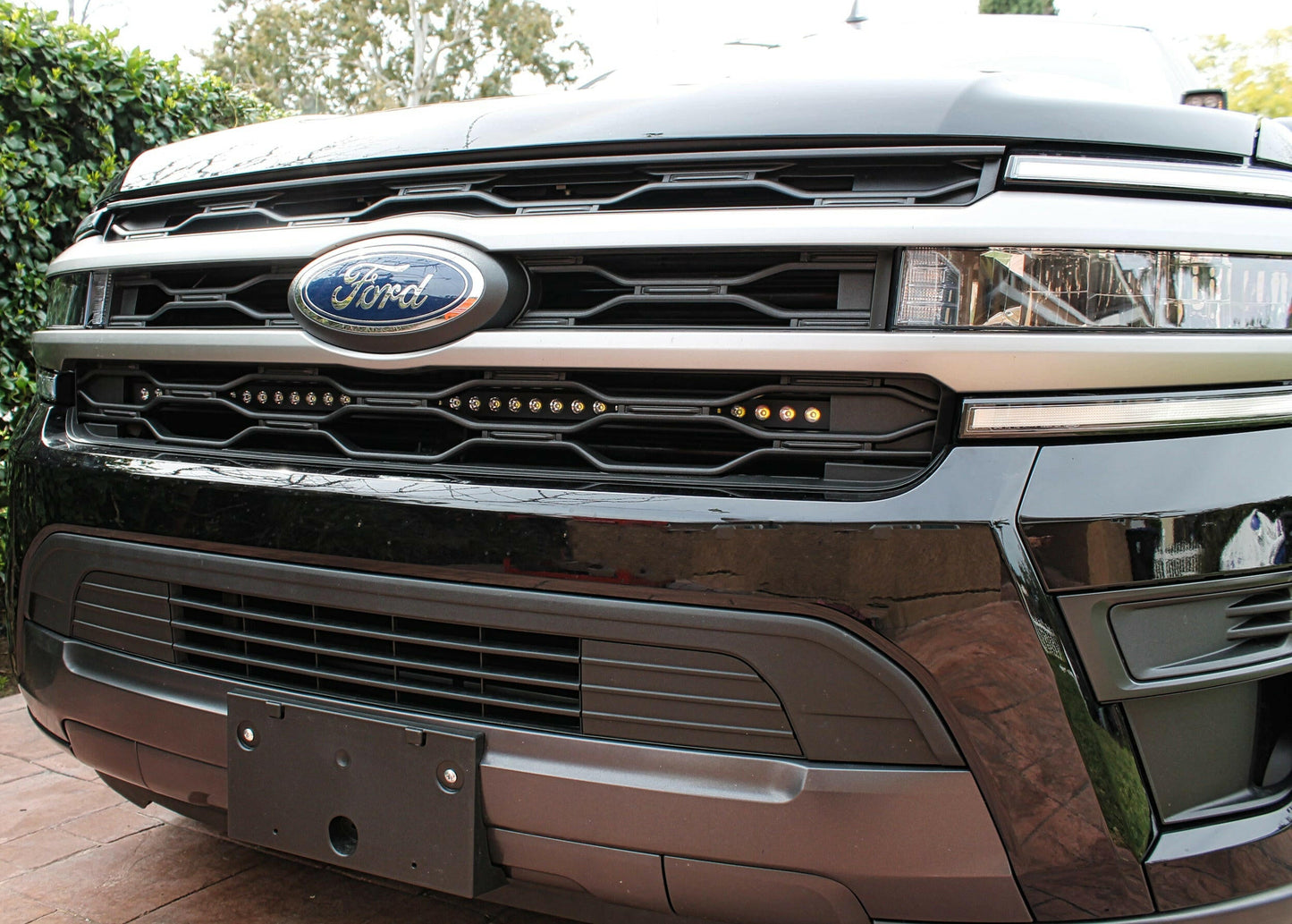 Close-up of a Ford vehicle grille with logo above Light Bar