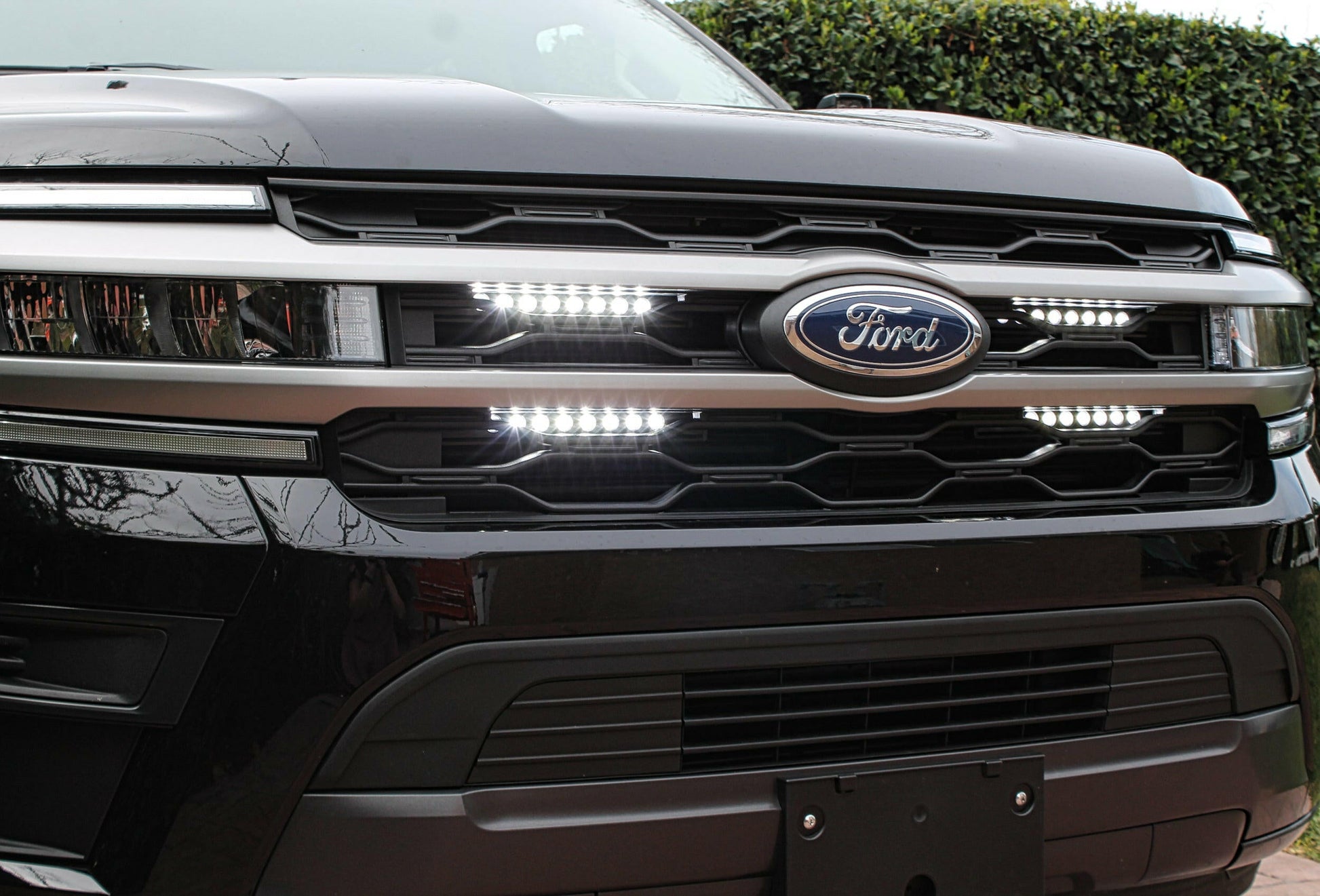 Close-up of a Ford vehicle's front grille with logo and LED Light Bars