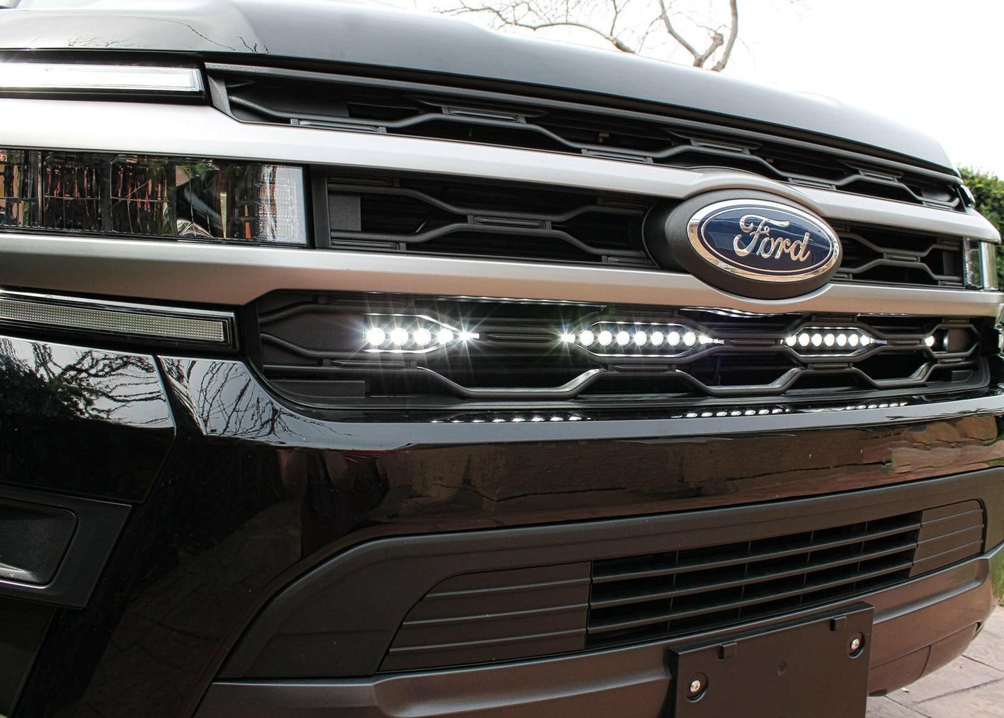 Close-up of a Ford vehicle grille with logo and LED Light Bar