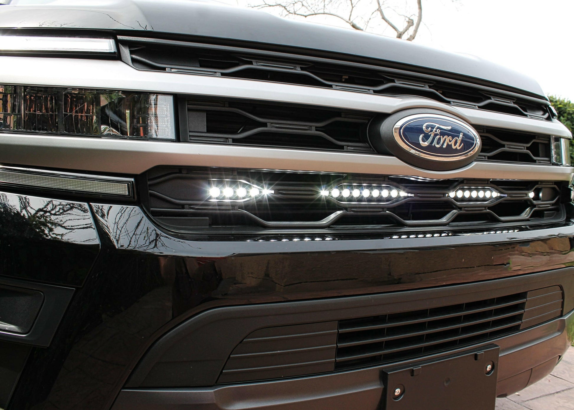 Close-up of a Ford vehicle grille with logo and LED Light Bar