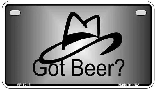 Motorcycle license plate with a black hat design and 'Got Beer?' text on a reflective surface.