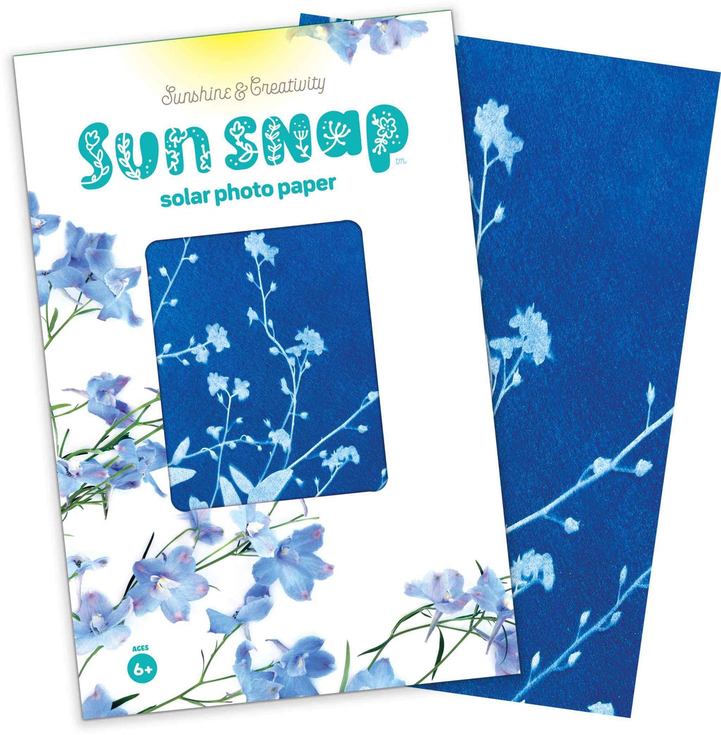 Sun Snap solar photo paper with blue floral design on packaging and paper.