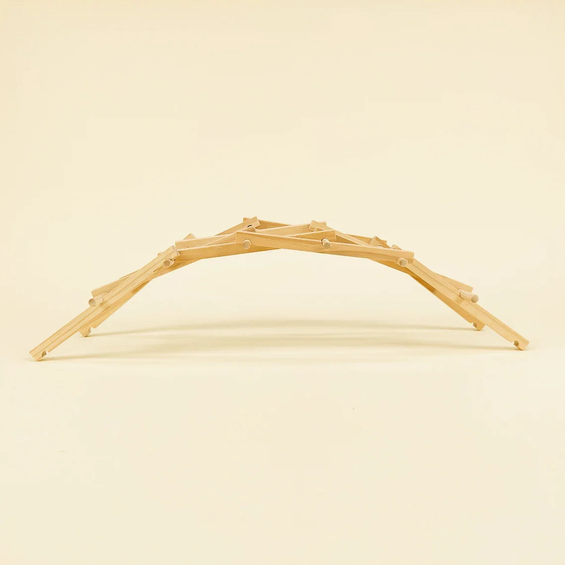 Wooden arch on a beige background