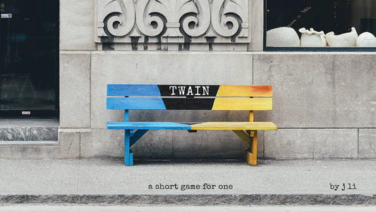 Colorful bench with 'TWAIN' branding against a stone building.