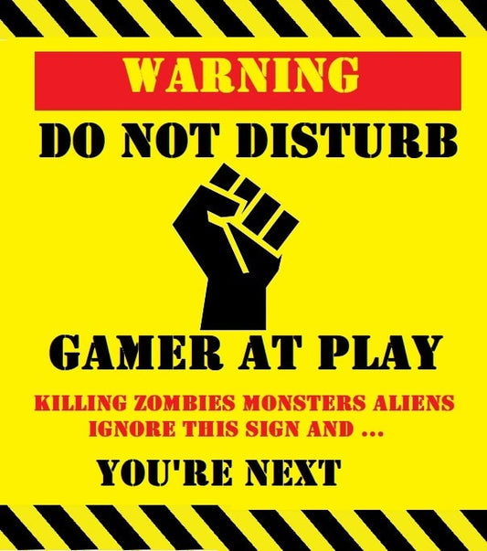 Warning GAMER AT PLAY KEEP OUT Laminated Sign. Warning sign with a fist symbol and text about not disturbing a gamer at play.