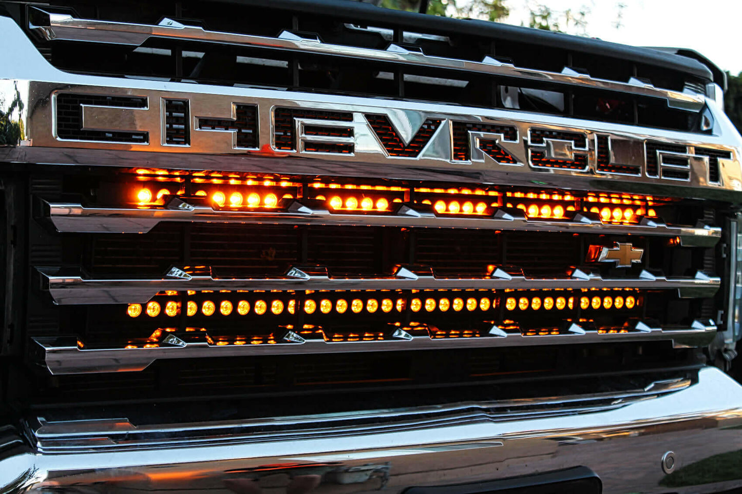 Close-up of a Chevrolet vehicle grille with LED lights