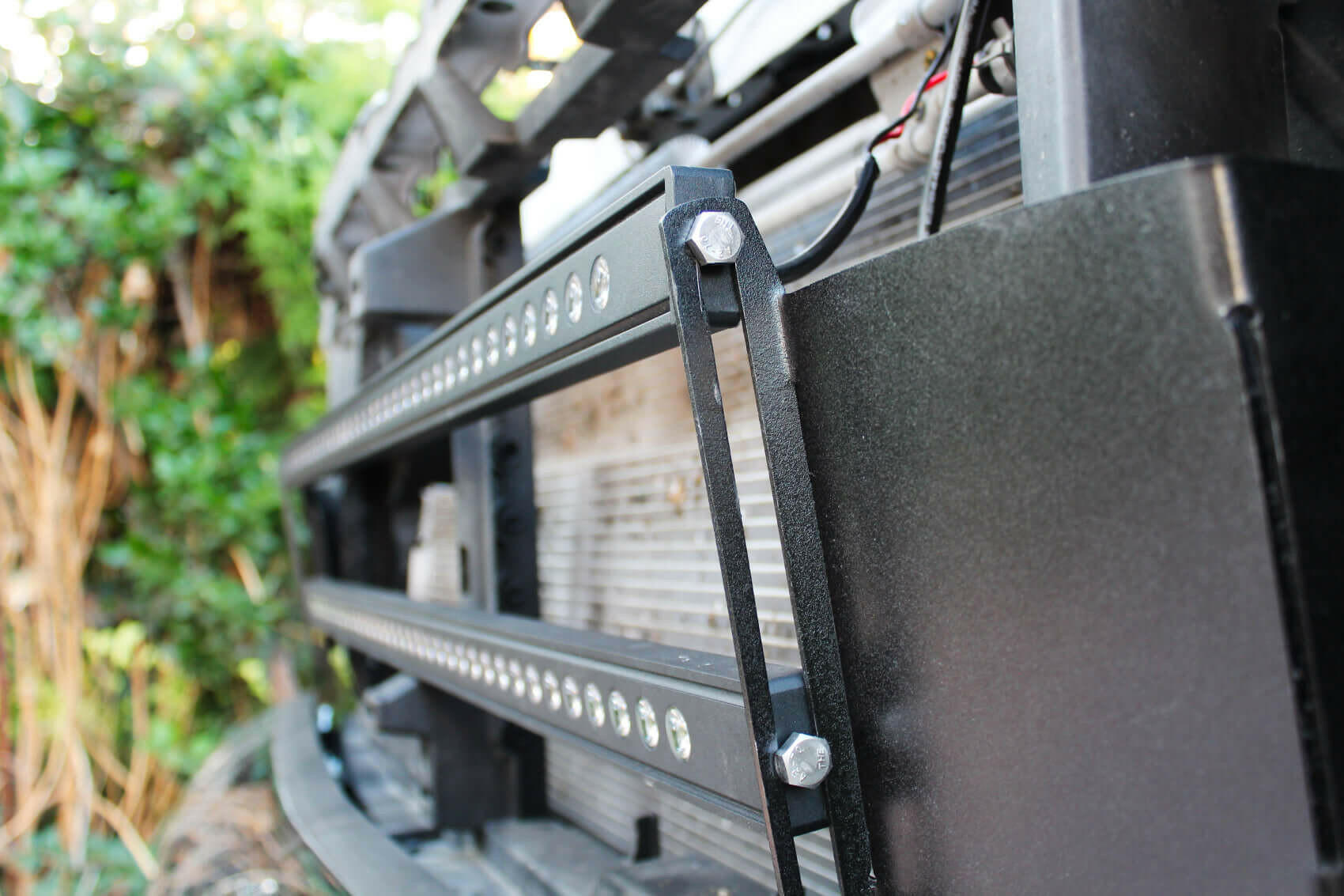 Close-up of a vehicle light bar with outdoor background