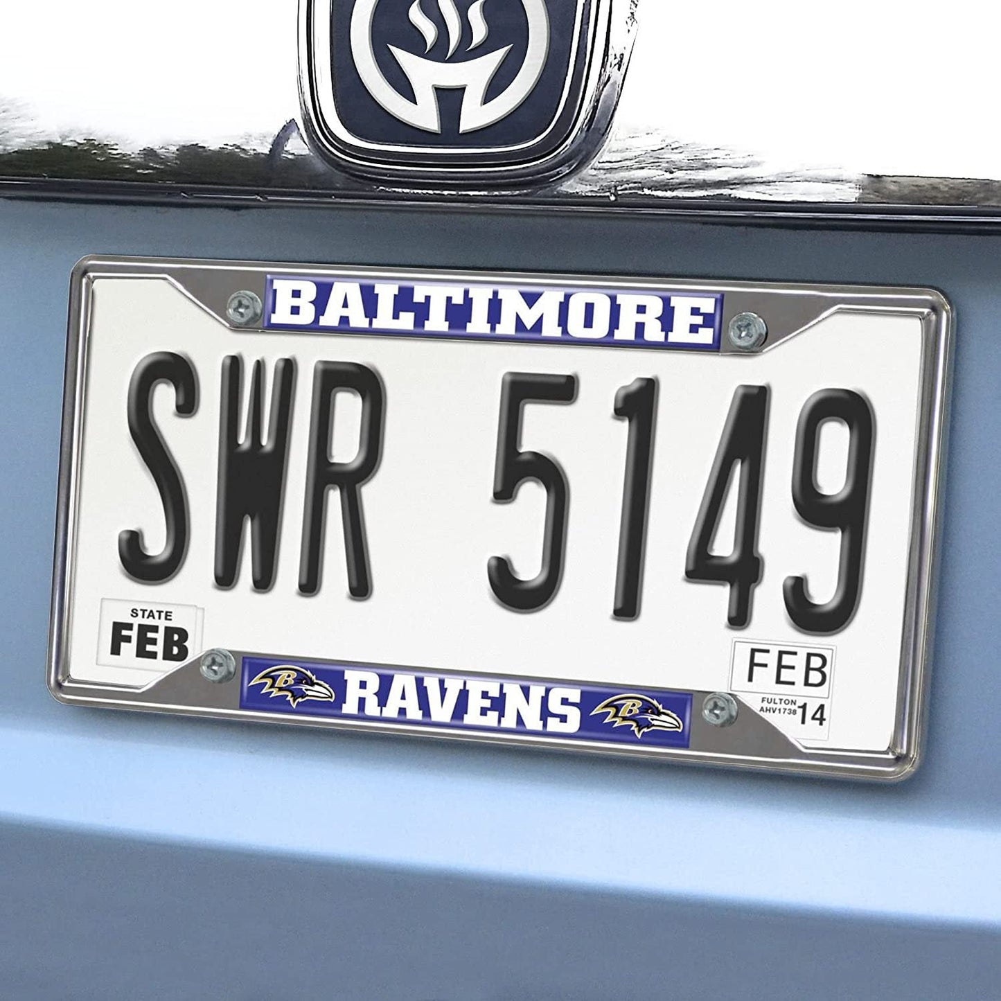 Baltimore Ravens license plate on a car with 'SWR 5149' and 'FEB' text.