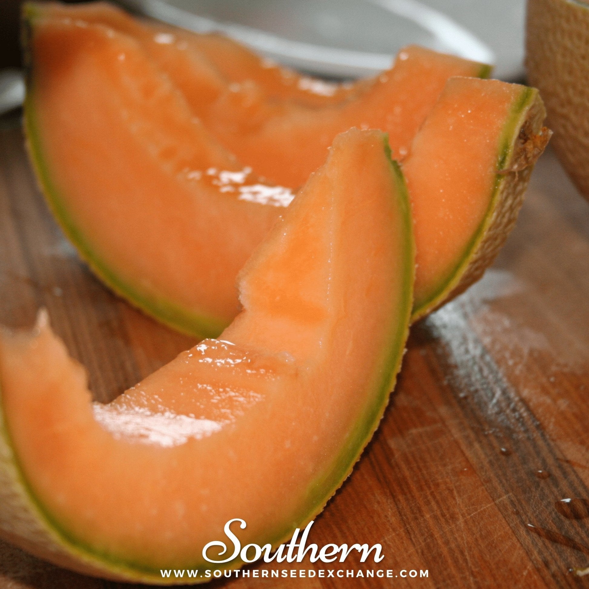 Sliced cantaloupe on a wooden cutting board with 'Southern' branding.