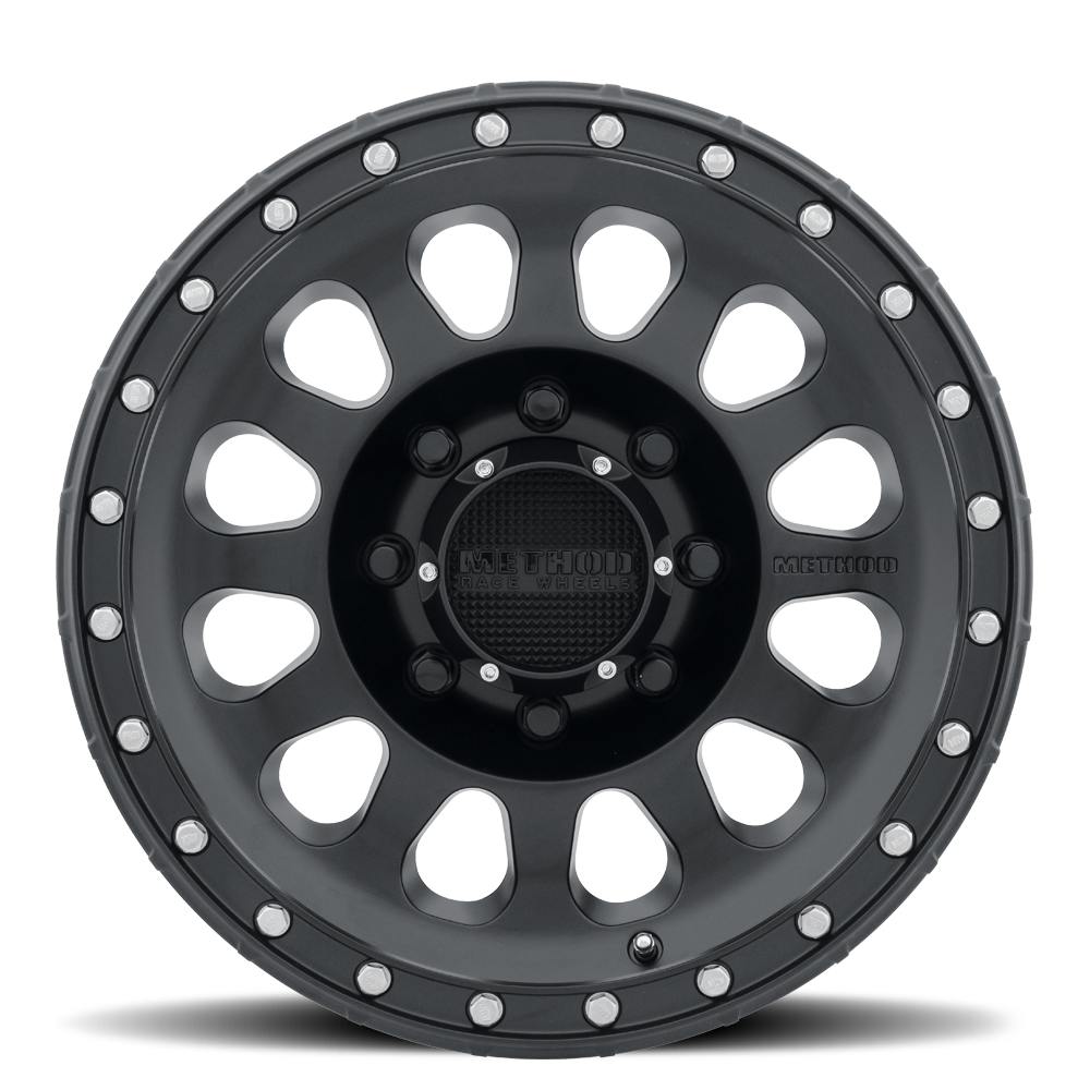 Black alloy wheel with unique design on a white background