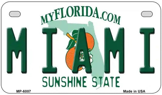 Motorcycle License plate with 'Miami' and 'Sunshine State' text, featuring oranges and a map of Florida. 