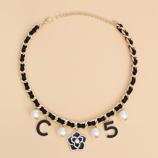 Gilded Glamour: The Camellia Charm Necklace